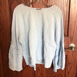 Light blue summer long sleeve. Detailing on sleeve